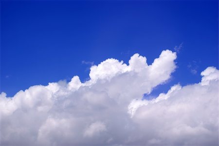 A bright blue sky above storm clouds Foto de stock - Super Valor sin royalties y Suscripción, Código: 400-05070980