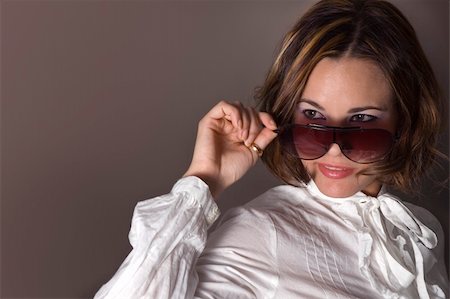 peeping fashion - Portrait of fashion female wearing sunglasses with seductive smile Stock Photo - Budget Royalty-Free & Subscription, Code: 400-05071485