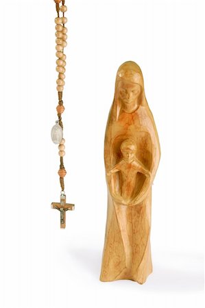 Wooden madonna figure with rosary - isolated on white background Stock Photo - Budget Royalty-Free & Subscription, Code: 400-05071891
