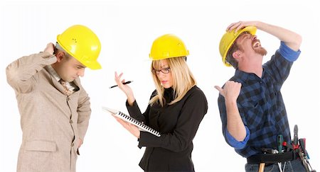 smiling industrial workers group photo - angry businesswoman and architect with architectural plans and construction worker tittering Stock Photo - Budget Royalty-Free & Subscription, Code: 400-05071909