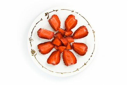 Sliced strawberries on plate over white Stock Photo - Budget Royalty-Free & Subscription, Code: 400-05072597