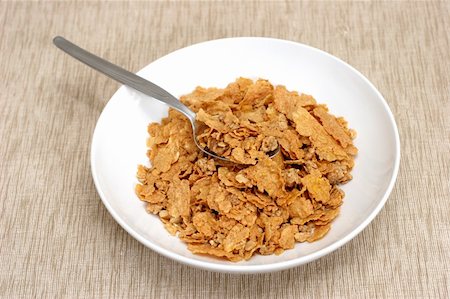 simsearch:400-03917186,k - Simple bowl and cornflakes on a brownish beige mat Stock Photo - Budget Royalty-Free & Subscription, Code: 400-05072787