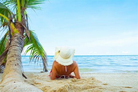 View of nice woman having fun on tropical beach Stock Photo - Budget Royalty-Free & Subscription, Code: 400-05073044