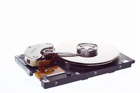 A hard disk isolated ona white background at an angle. Stockbilder - Microstock & Abonnement, Bildnummer: 400-05073381