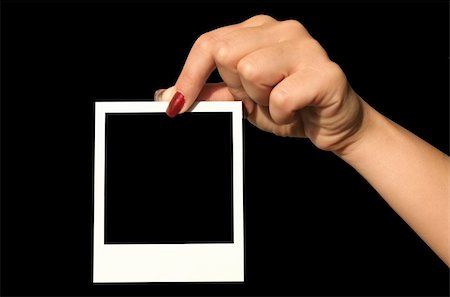 simsearch:400-05004050,k - holding photo frame Photographie de stock - Aubaine LD & Abonnement, Code: 400-05073815