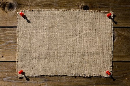 Textile Patch On Dark Wooden Texture Stock Photo - Budget Royalty-Free & Subscription, Code: 400-05073945