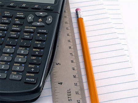 Pencil ruler and calculator on a pad of paper Stock Photo - Budget Royalty-Free & Subscription, Code: 400-05073958