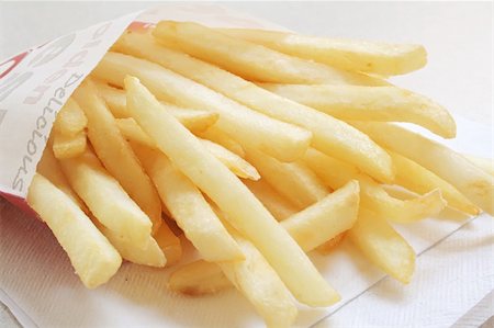simsearch:400-05057923,k - French Fries from a Fastfood Chain on a white table Foto de stock - Super Valor sin royalties y Suscripción, Código: 400-05073962