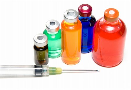 Several prescription medicine vials and a syringe. Stock Photo - Budget Royalty-Free & Subscription, Code: 400-05084670