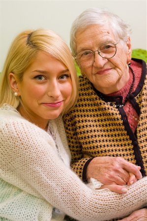 daughter helping elderly parent - An old woman and her grandchild sitting close to each other (focus on the young woman) - part of a series. Stock Photo - Budget Royalty-Free & Subscription, Code: 400-05084905