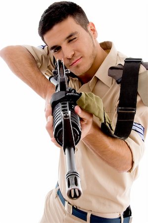 young soldier going to shoot with gun on an isolated background Stock Photo - Budget Royalty-Free & Subscription, Code: 400-05084993