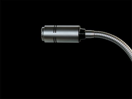 Closeup of a desk microphone isolated on black background Stock Photo - Budget Royalty-Free & Subscription, Code: 400-05085203