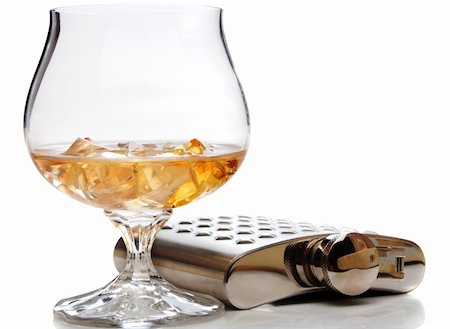 Brandy glass with ice and hip flask, isolated Stock Photo - Budget Royalty-Free & Subscription, Code: 400-05085434