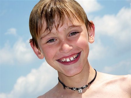 sparkia (artist) - a happy young boy wet from swimming Stockbilder - Microstock & Abonnement, Bildnummer: 400-05085948