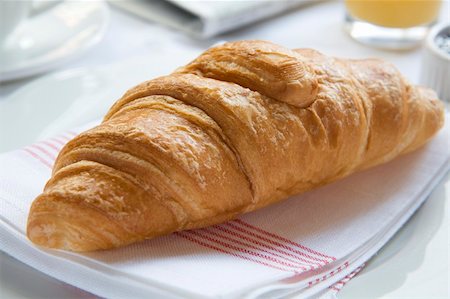 Continental Breakfast With Croissant On Napkin Fotografie stock - Microstock e Abbonamento, Codice: 400-05086081