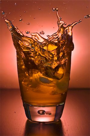 glass of alcoholic beverage whith ice cubes Stock Photo - Budget Royalty-Free & Subscription, Code: 400-05086264