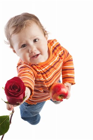 simsearch:400-05130009,k - Kid giving a red rose, isolated Stock Photo - Budget Royalty-Free & Subscription, Code: 400-05086416