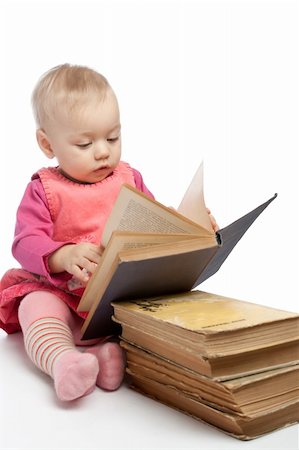 simsearch:400-04637418,k - Baby girl reading old shabby book, isolated Stock Photo - Budget Royalty-Free & Subscription, Code: 400-05086418