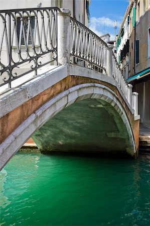 simsearch:400-05384275,k - Nice stone bridge over green water of a venetian canal, Italy Stock Photo - Budget Royalty-Free & Subscription, Code: 400-05086421