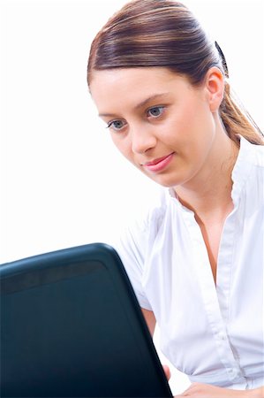 simsearch:400-05732500,k - Portrait of young beautiful woman getting busy with her laptop Foto de stock - Royalty-Free Super Valor e Assinatura, Número: 400-05086743