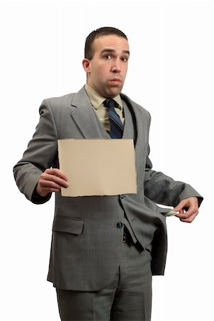 person holding their empty pockets - A bankrupt businessman holding a blank cardboard sign, isolated against a white background Stock Photo - Budget Royalty-Free & Subscription, Code: 400-05086865