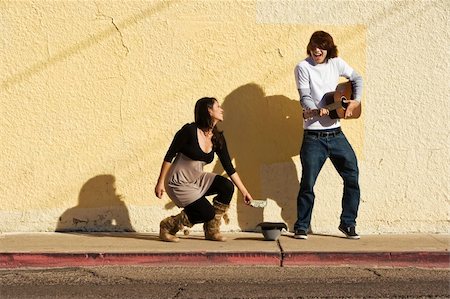 street entertainer - Musician on Sidewalk and Woman Pedestrian Stock Photo - Budget Royalty-Free & Subscription, Code: 400-05086983