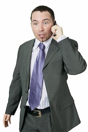 A handsome businessman getting bad news on his cellphone. Stock Photo - Budget Royalty-Free & Subscription, Code: 400-05087188