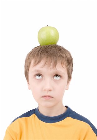 Young boy with apple isolated on white Stock Photo - Budget Royalty-Free & Subscription, Code: 400-05087355