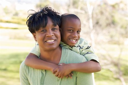 Happy Woman and Child having fun in the park. Photographie de stock - Aubaine LD & Abonnement, Code: 400-05087497