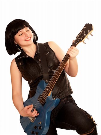 Young woman plays on a electric guitar Foto de stock - Super Valor sin royalties y Suscripción, Código: 400-05087681