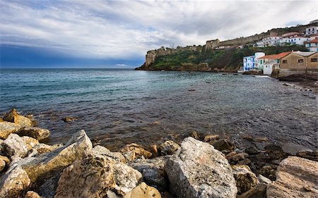 simsearch:400-05118735,k - Seascape in Koroni, southern Greece, showing rocks in the foreground and its famous venetian medieval fortress in the background. Stock Photo - Budget Royalty-Free & Subscription, Code: 400-05088015