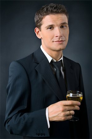 Portrait of a beautiful man with a glass of champagne Stock Photo - Budget Royalty-Free & Subscription, Code: 400-05088104