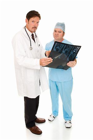 simsearch:400-05088220,k - Serious doctors going over MRI test results.  Full body isolated on white. Stock Photo - Budget Royalty-Free & Subscription, Code: 400-05088217