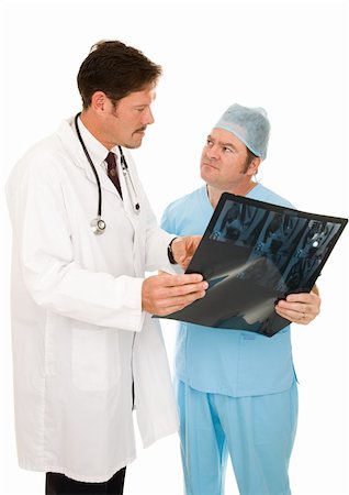 simsearch:400-04552598,k - Doctor consulting with a surgeon on a patient's MRI.  Isolated on white. Foto de stock - Super Valor sin royalties y Suscripción, Código: 400-05088218