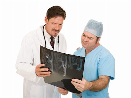 simsearch:400-04552598,k - Doctors reviewing and discussing a patient's MRI test results.  Isolated on white. Foto de stock - Super Valor sin royalties y Suscripción, Código: 400-05088213