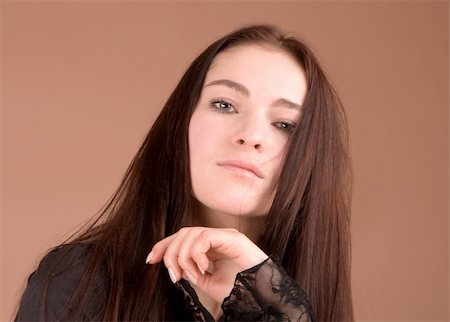 simsearch:400-04763033,k - Woman in black portrait isolated on beige background Photographie de stock - Aubaine LD & Abonnement, Code: 400-05088501