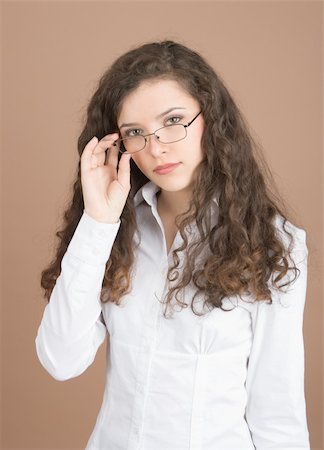 simsearch:400-04763033,k - Young businesswoman serious looking isolated on beige background Photographie de stock - Aubaine LD & Abonnement, Code: 400-05088666