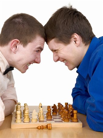 Mans to play chess on a white background Stock Photo - Budget Royalty-Free & Subscription, Code: 400-05089316