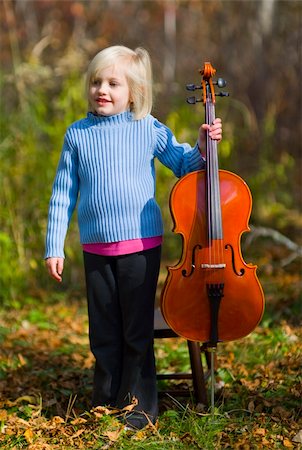 A child standing with her cello outside on a crisp autumn day. Stock Photo - Budget Royalty-Free & Subscription, Code: 400-05089380