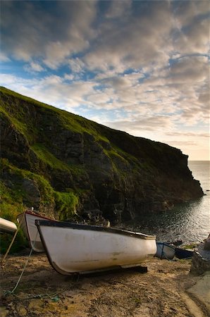 fishing dawn tranquil - Small fishing boats moored up on the slipway in a Cornish village in England, UK. Stock Photo - Budget Royalty-Free & Subscription, Code: 400-05089506