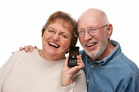 simsearch:400-04522125,k - Happy Senior Couple Using Cell Phone Isolated on a White Background. Stock Photo - Budget Royalty-Free & Subscription, Code: 400-05089877
