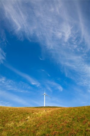 simsearch:400-04024418,k - Wind tower on a field with blue sky. Fotografie stock - Microstock e Abbonamento, Codice: 400-05080631