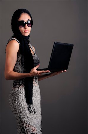 simsearch:400-04542798,k - Portrait of young fashion female holding laptop Photographie de stock - Aubaine LD & Abonnement, Code: 400-05080877