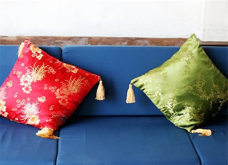 Red and green oriental cushions on a sofa. Stock Photo - Budget Royalty-Free & Subscription, Code: 400-05081079