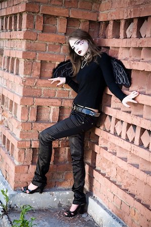 Gothic Young Woman On The Wall Background Stock Photo - Budget Royalty-Free & Subscription, Code: 400-05081583