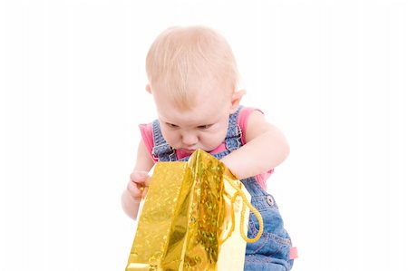 small girl looking presents in the bag Photographie de stock - Aubaine LD & Abonnement, Code: 400-05081898