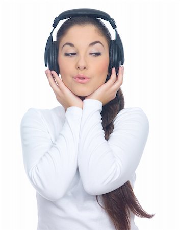 Beautiful young lady is listen to the music, isolated Foto de stock - Super Valor sin royalties y Suscripción, Código: 400-05082037