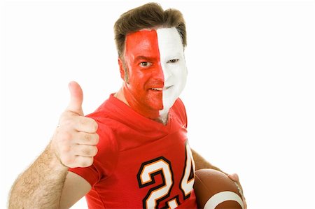 face painting for football - Football fan in jersey and face paint giving a thumbs up sign.  Isolated on white. Stock Photo - Budget Royalty-Free & Subscription, Code: 400-05082211