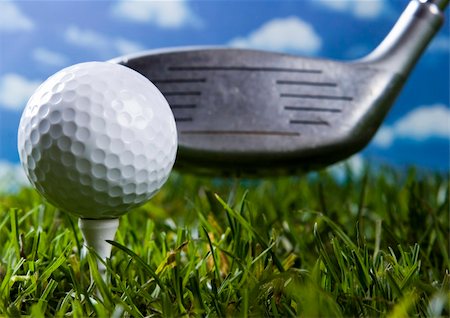 range shooting - Golf ball on tee in grass. Foto de stock - Super Valor sin royalties y Suscripción, Código: 400-05082332