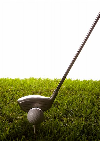 range shooting - Golf ball on tee in grass. Foto de stock - Super Valor sin royalties y Suscripción, Código: 400-05082365